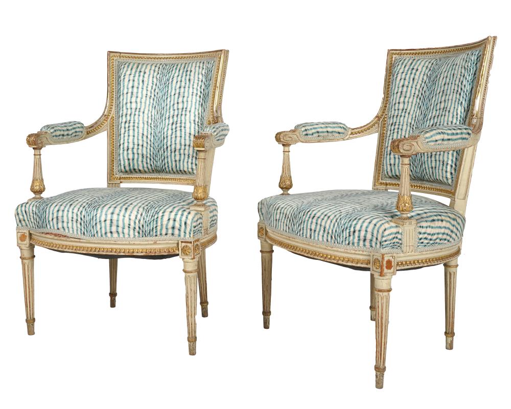 Appraisal: PAIR LOUIS XVI-STYLE WHITE-PAINTED GILT FAUTEUILScovered with green and white