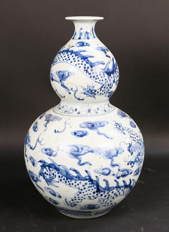 Appraisal: Chinese porcelain gourd vase Decorated with dragons and clouds H