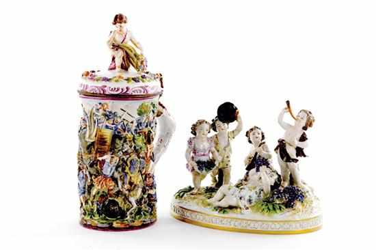 Appraisal: Capodimonte lidded tankard and figural group tankard with young fortuna