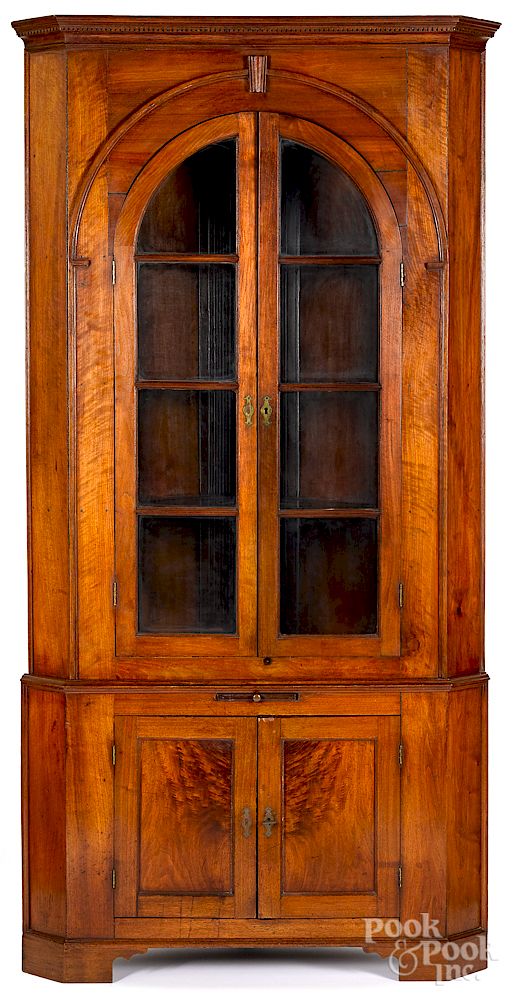 Appraisal: Pennsylvania walnut two-part corner cupboard Exclusive on Bidsquare Pennsylvania walnut