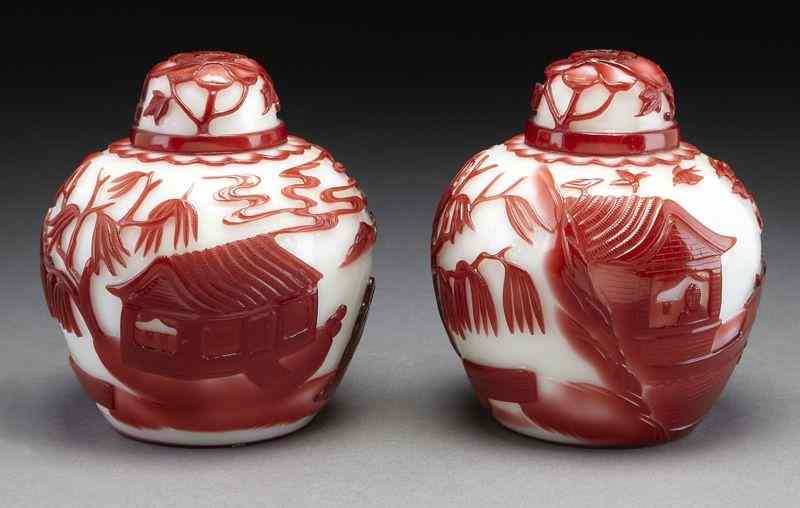 Appraisal: Pr Chinese Peking glass red and white lidded jarsdepicting figures