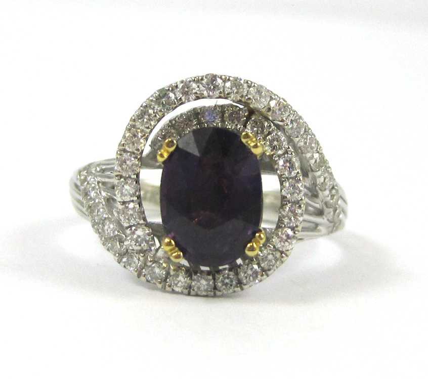 Appraisal: PURPLE SAPPHIRE DIAMOND AND FOURTEEN KARAT GOLD RING approximately cts