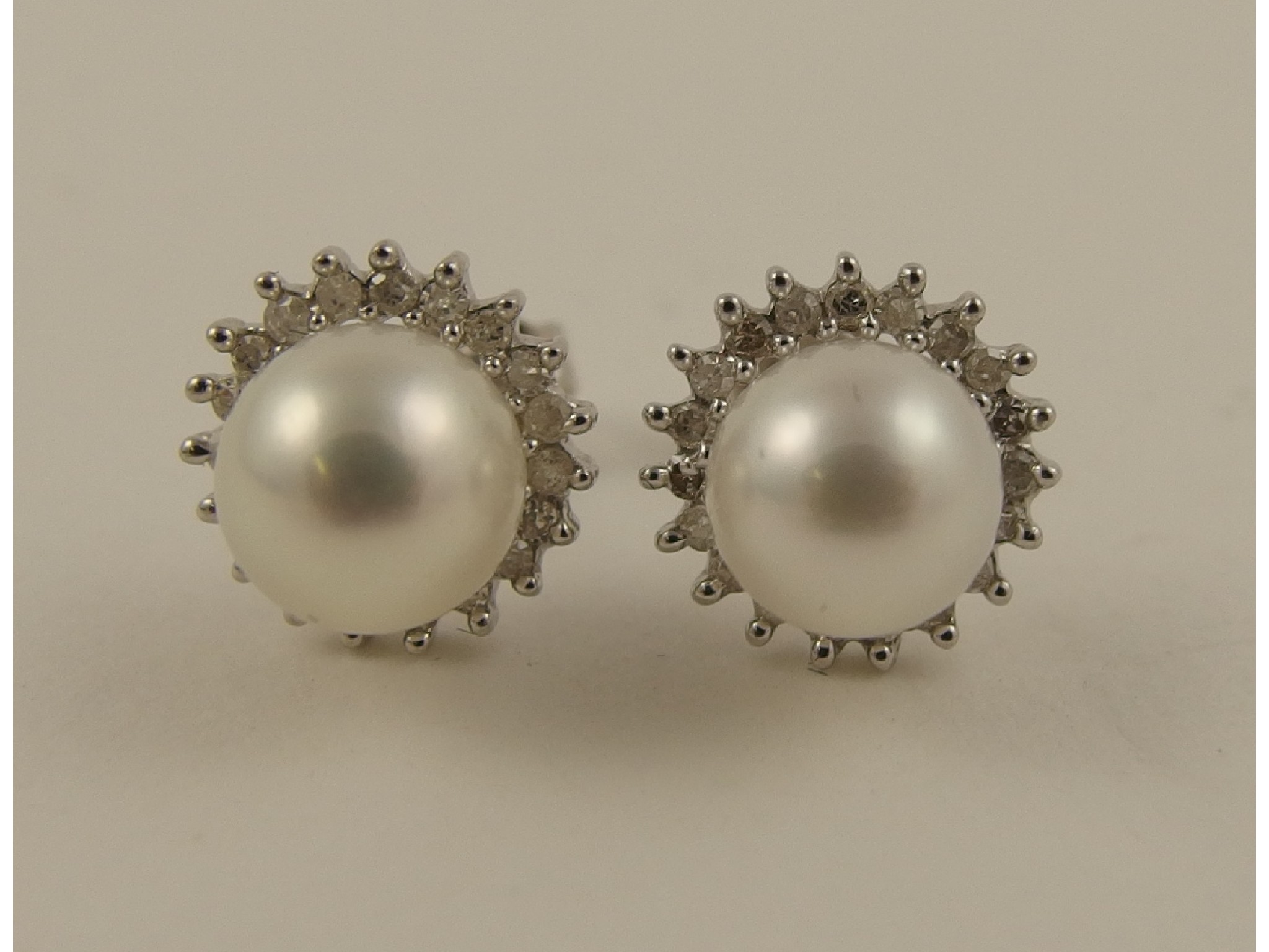 Appraisal: A pair of ct white gold diamond and cultured pearl