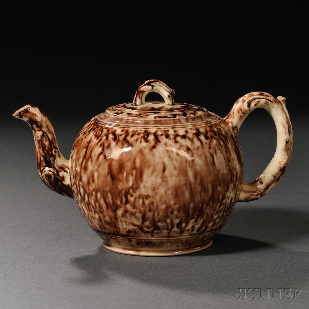 Appraisal: Staffordshire Cream-colored Earthenware Teapot and Cover England c globular with