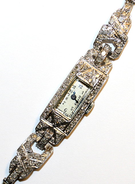 Appraisal: AN EDWARDIAN DIAMOND SET COCKTAIL WATCH rectangular face with Arabic