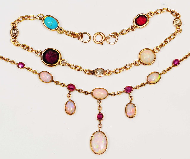 Appraisal: A ct gold braceletwith hardstone settings including garnets diamonds opals