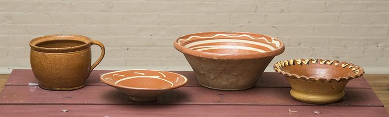 Appraisal: THREE AMERICAN SLIPWARE BOWLS Comprising a large conical bowl x