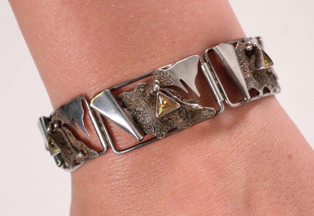 Appraisal: Sterling silver abstract cut out panel link bracelet having faceted