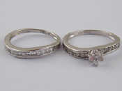 Appraisal: Two white metal tests carat gold rings set with clear