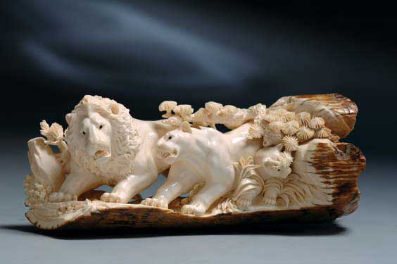 Appraisal: FINELY CARVED FOSSIL IVORY Fossil mammoth ivory tusk section with