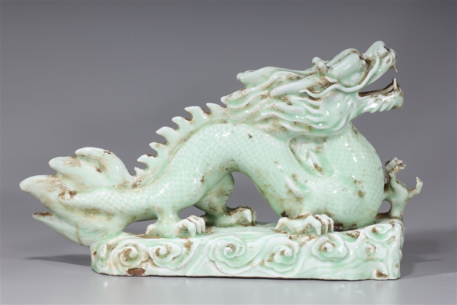 Appraisal: Chinese celadon glazed porcelain dragon on clouds measuring x x