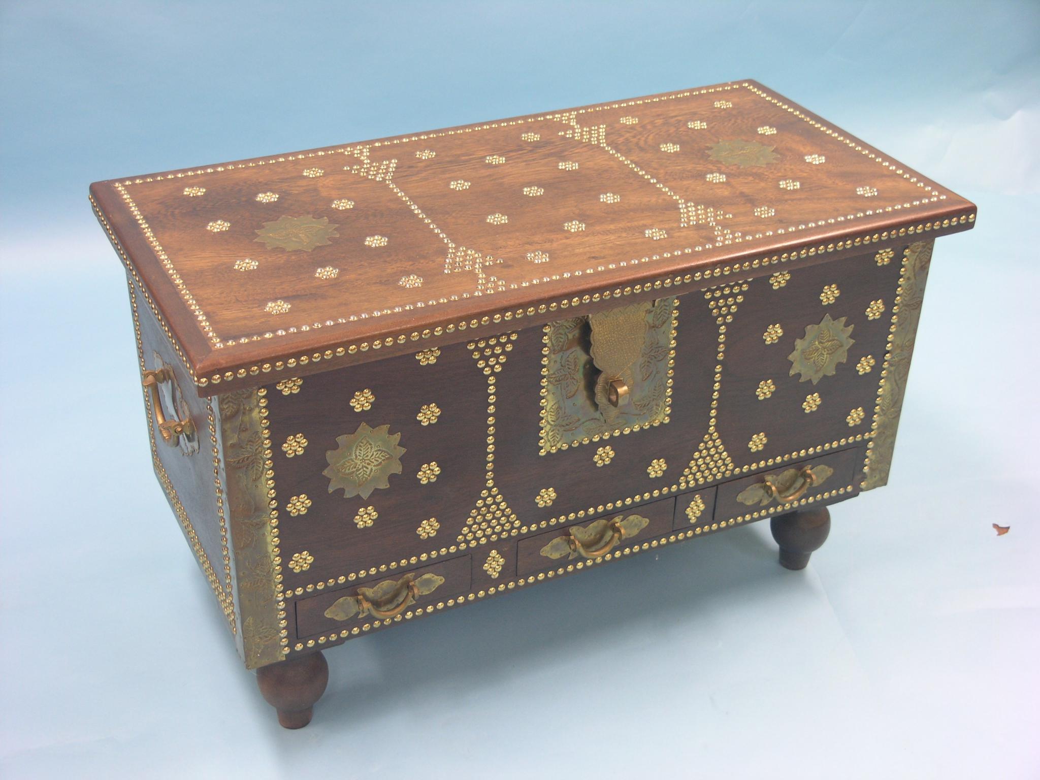 Appraisal: A Zanzibar chest mahogany ornamented with brass studs and embossed