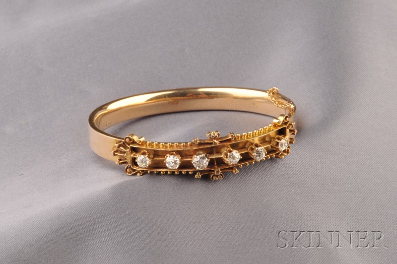 Appraisal: kt Gold and Diamond Bracelet the hinged bangle set with