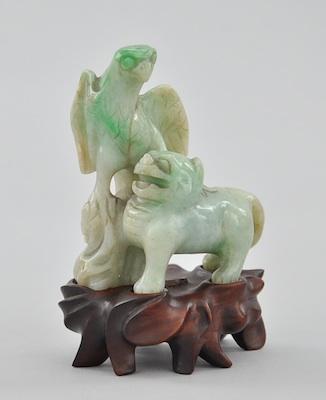 Appraisal: A Carved Jadeite Lion and Bird Figure The carving depicts