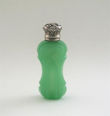 Appraisal: A Victorian mounted glass scent with a shaped and faceted