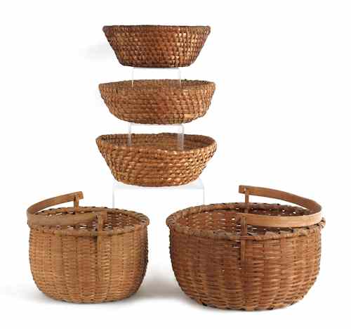 Appraisal: Two Pennsylvania split oak baskets with swing handles ca together