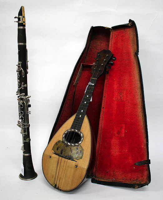 Appraisal: A SINATTA CLARINET together with a cased Alfonso Moretti mandolin