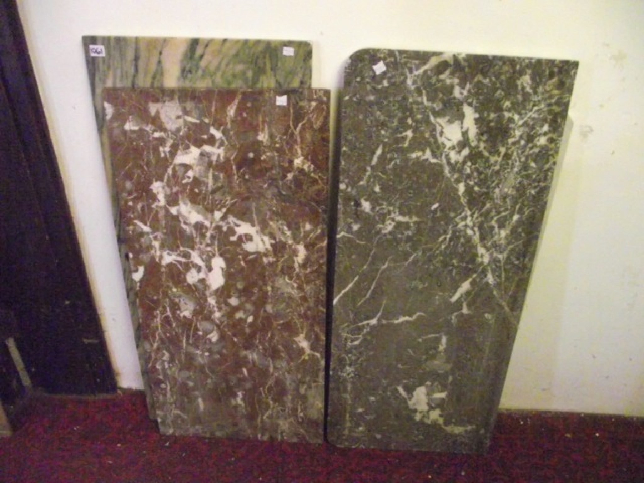 Appraisal: Four rectangular reclaimed slabs of decorative veined marble varying size