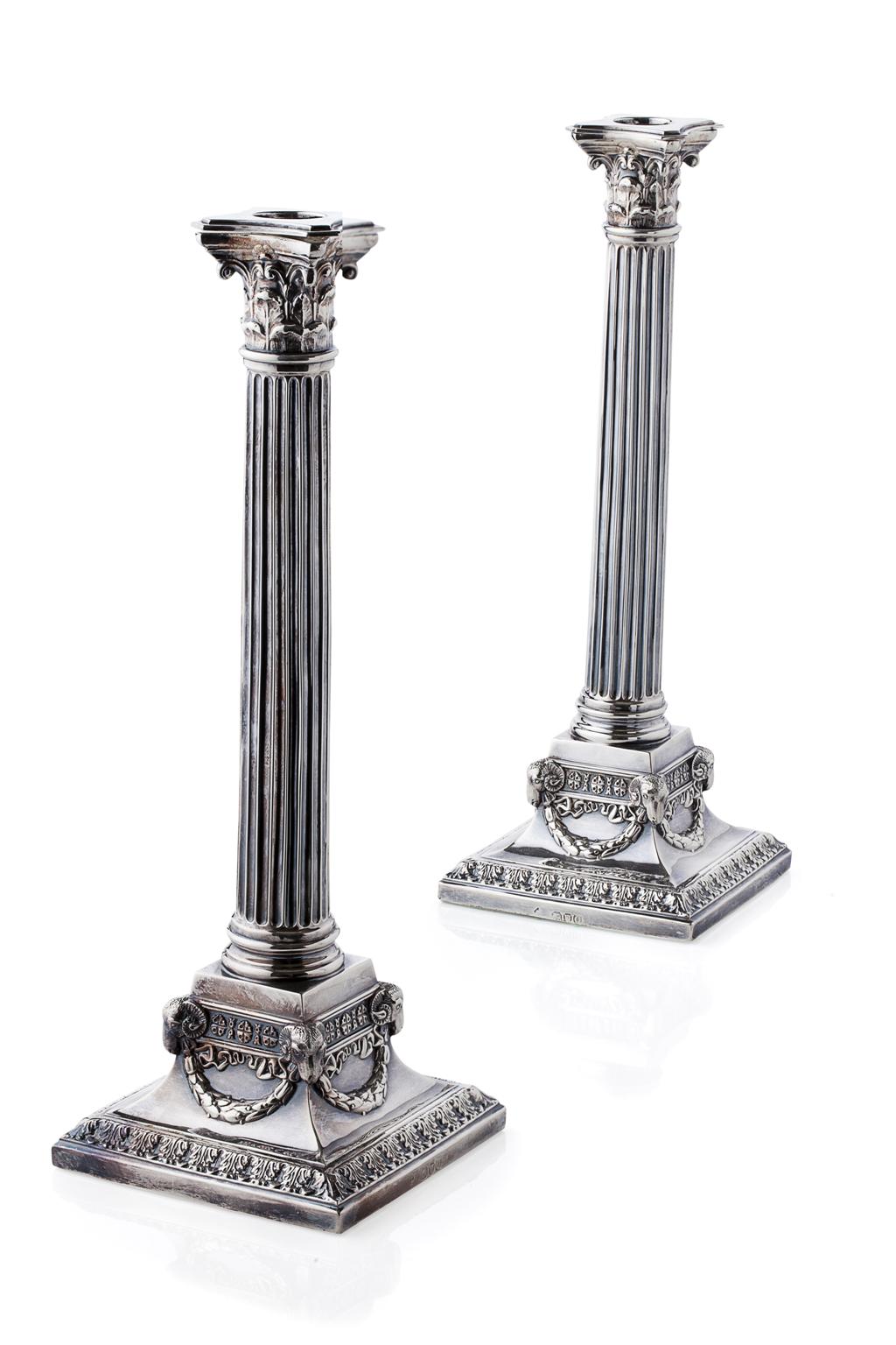 Appraisal: A pair of corinthian column candlesticks London of typical form