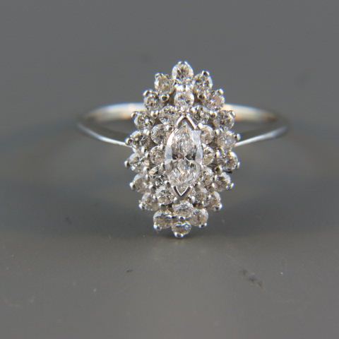 Appraisal: Diamond Fashion Ring marquise cut diamond surrounded by round diamonds