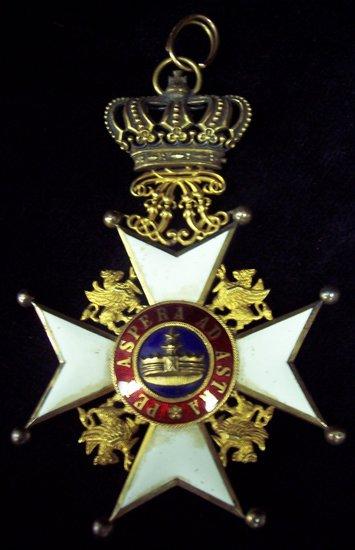 Appraisal: A white enamel star shaped medal monogrammed and with motto