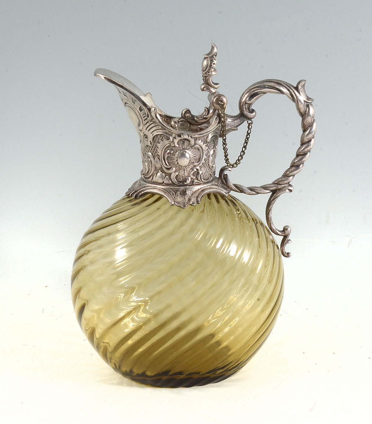 Appraisal: METAL MOUNTED CLARET JUG Claret wine jug having an amber