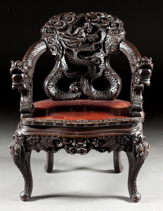 Appraisal: Chinese carved hardwood armchair late th century open-work serpent carved