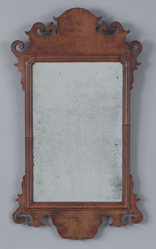 Appraisal: Georgian walnut veneer looking glass ca with scrolled crest and