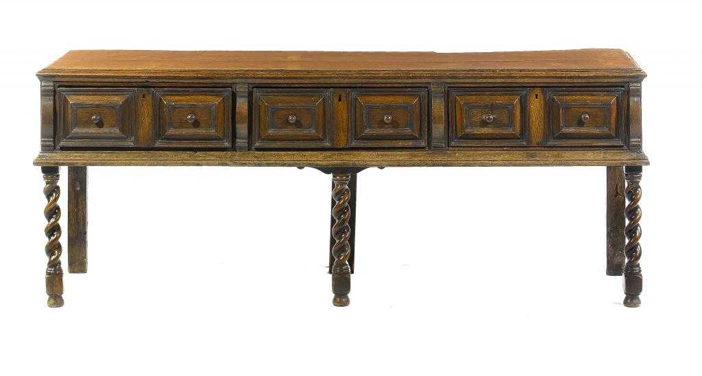 Appraisal: A WILLIAM III OAK DRESSER fitted with three geometric moulded