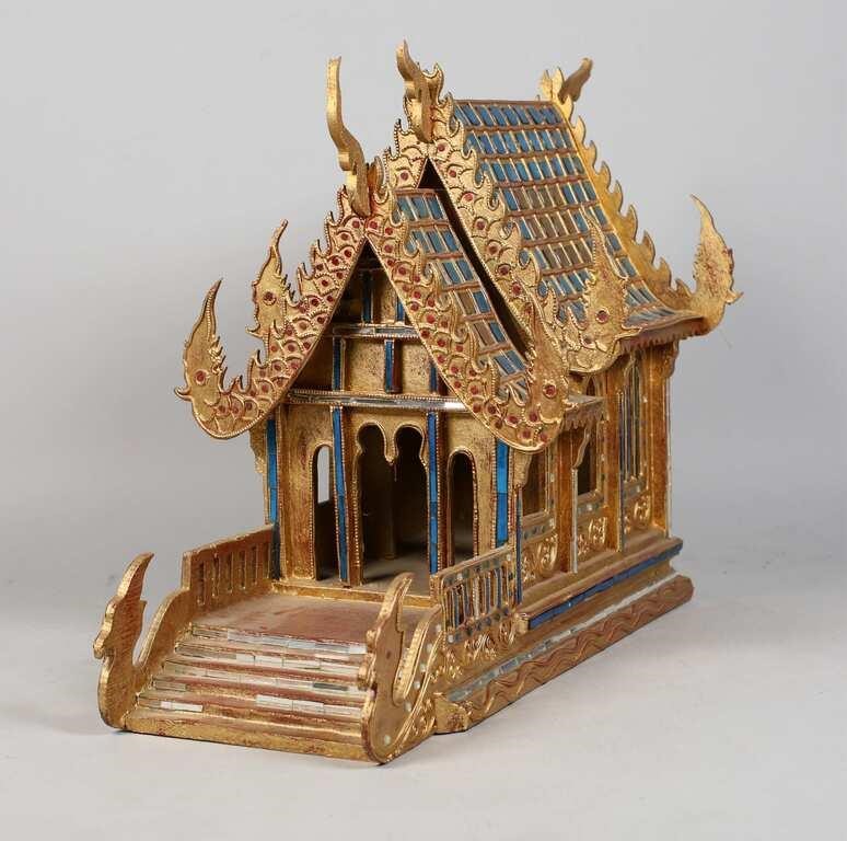 Appraisal: A Thai hand carved gilt spirit house with glass mirror