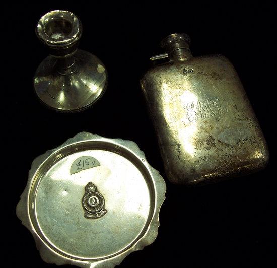 Appraisal: A hip flask monogrammed Chester a dwarf candlestick and an