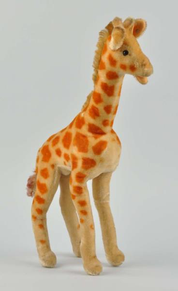 Appraisal: Steiff Giraffe This giraffe still has his Steiff ear button