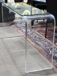 Appraisal: Moderne acrylic console table Moderne acrylic console table having an