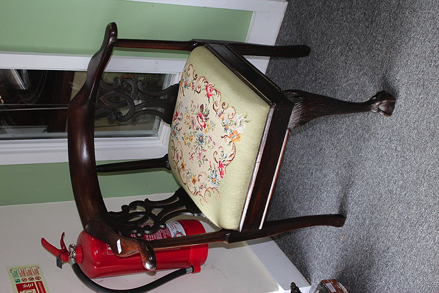 Appraisal: A GEORGE III MAHOGANY CORNER CHAIR with pierced splats inset