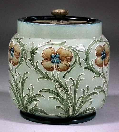 Appraisal: A MacIntyre Moorcroft tobacco jar and lid decorated with a