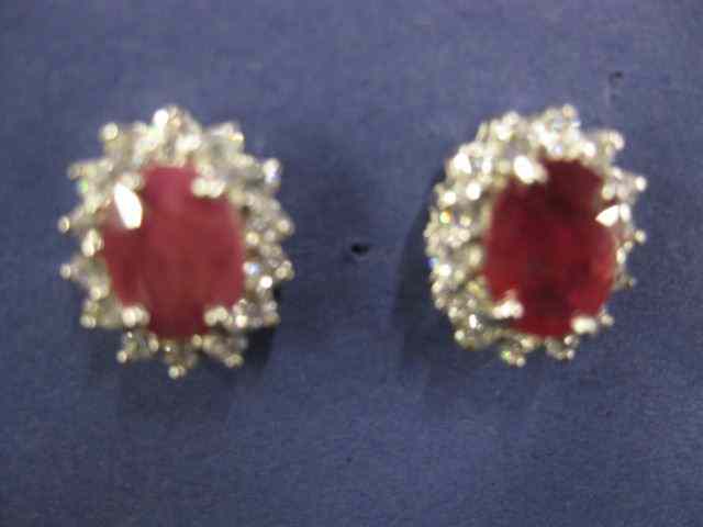 Appraisal: Ruby White Sapphire Earrings ovalrubies surrounded by round sapphires in