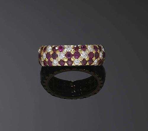 Appraisal: RUBY AND BRILLIANT-CUT DIAMOND RING Yellow gold Casual-elegant band ring