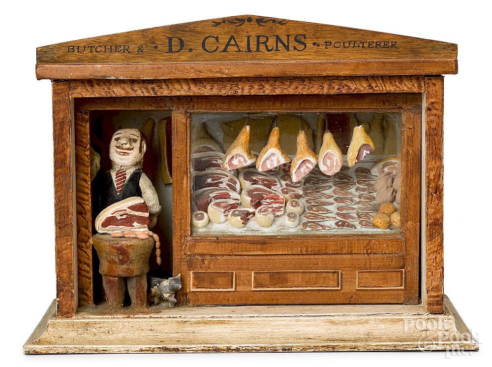 Appraisal: German painted composition butcher shop German painted composition butcher shop