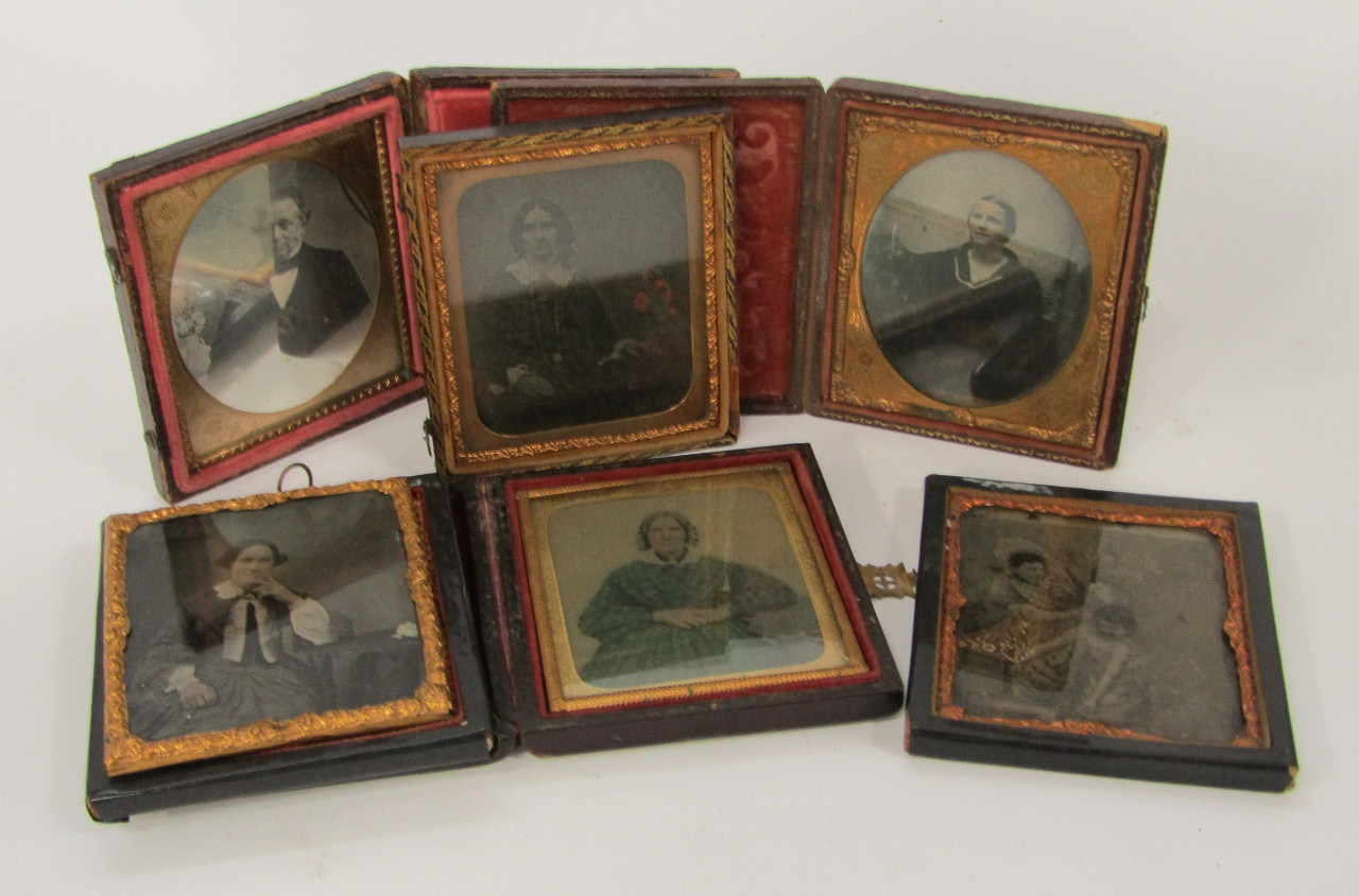 Appraisal: Victorian daguerreotypes including portraits man and woman on a bicycle