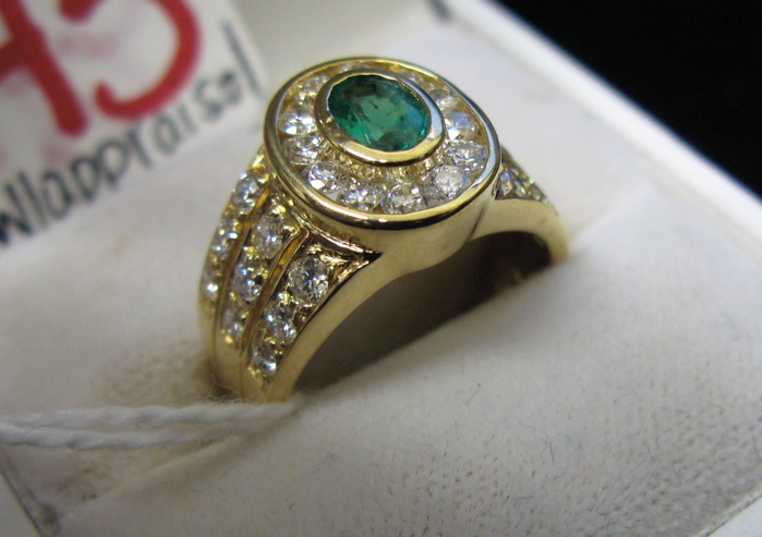 Appraisal: EMERALD DIAMOND AND EIGHTEEN KARAT GOLD RING WITH APPRAISAL set