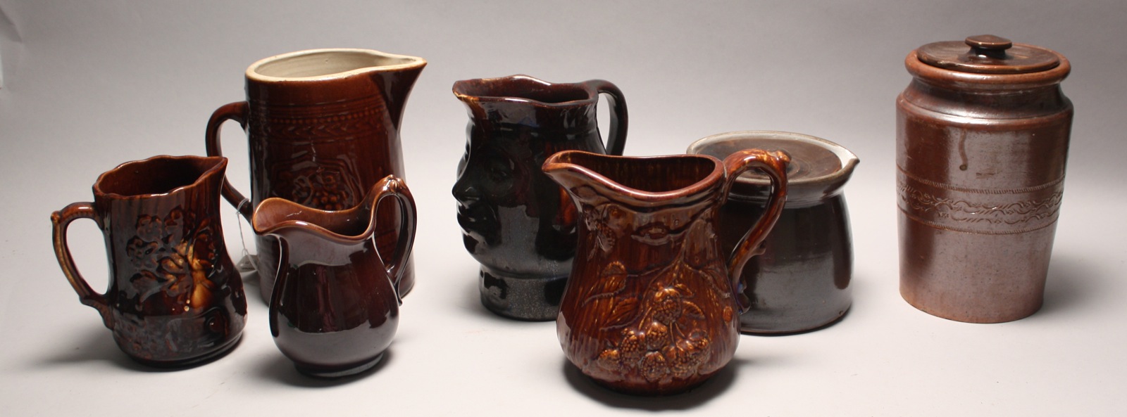 Appraisal: SEVEN BROWN-GLAZE EARTHENWARE PITCHERS JUGS AND CROCKS Late th Early