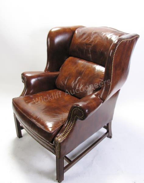 Appraisal: Contemporary leather wing chair Chippendale period style frame with nailhead