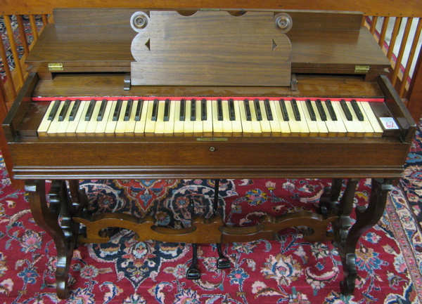 Appraisal: A VICTORIAN WALNUT MELODEON American th century The portable reed