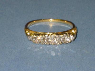 Appraisal: A VICTORIAN FIVE STONE DIAMOND RING the graduated old brilliant