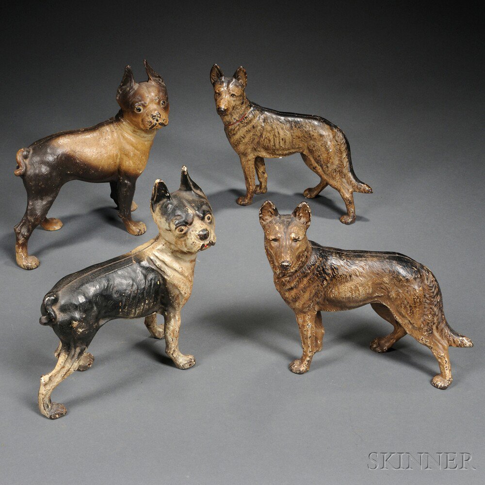 Appraisal: Four Painted Cast Iron Dog Door Stops early th century