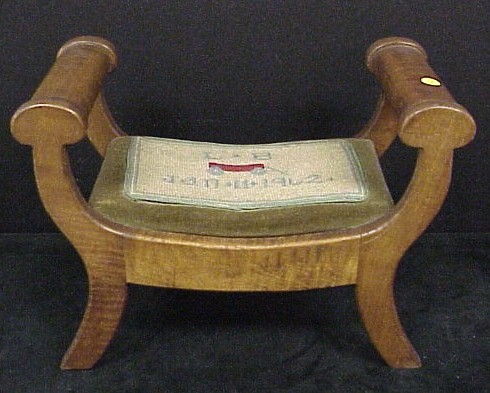 Appraisal: Footstool early th C figured maple with saber legs later