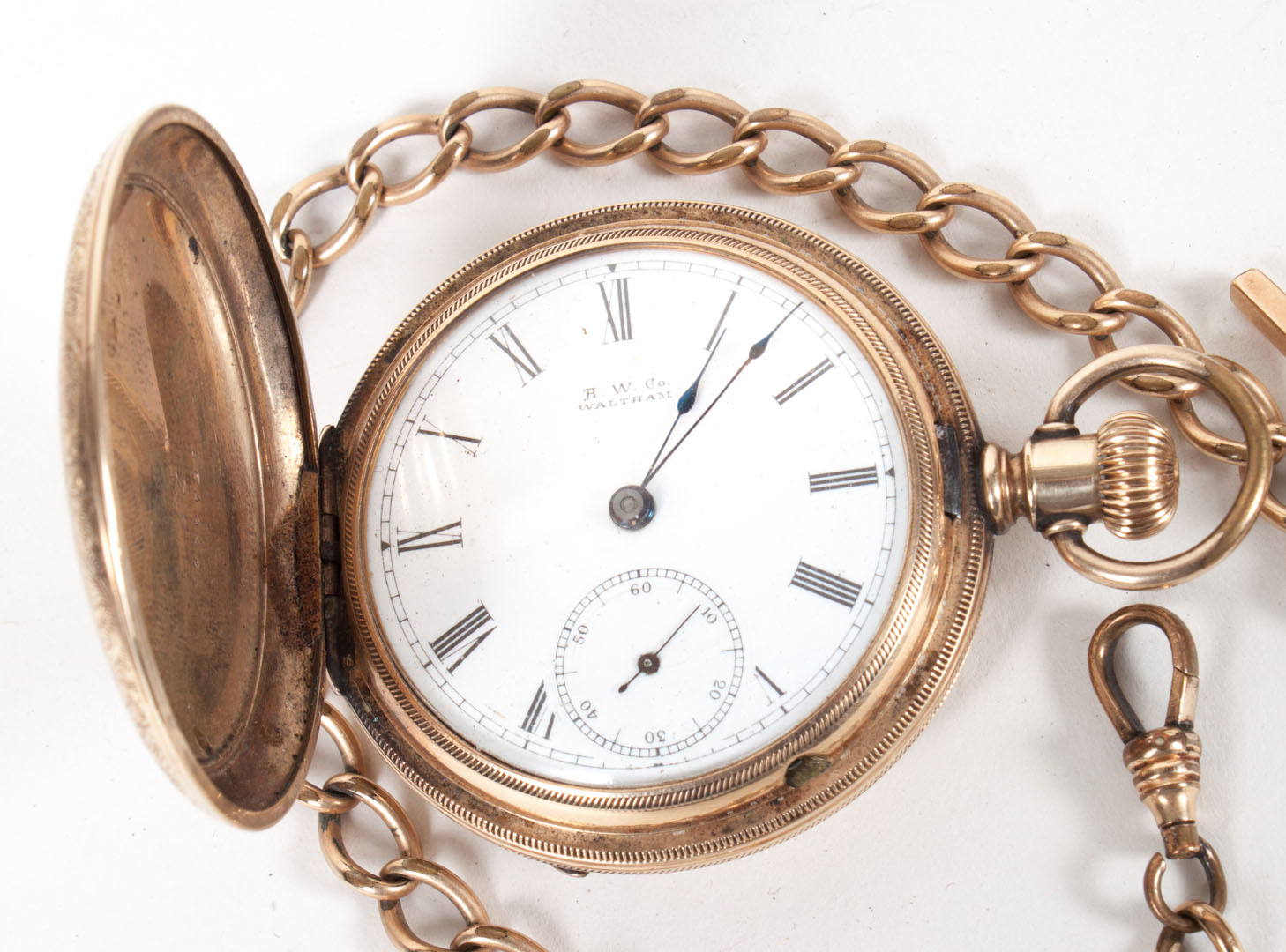 Appraisal: Waltham pocket watch and chain Condition We make no guarantee