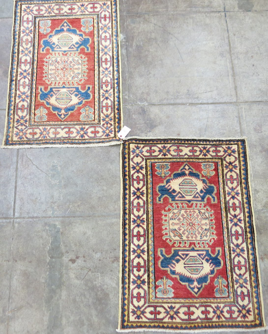 Appraisal: A MATCHING PAIR OF ORIENTAL AREA RUGS Pakistani Caucasians hand