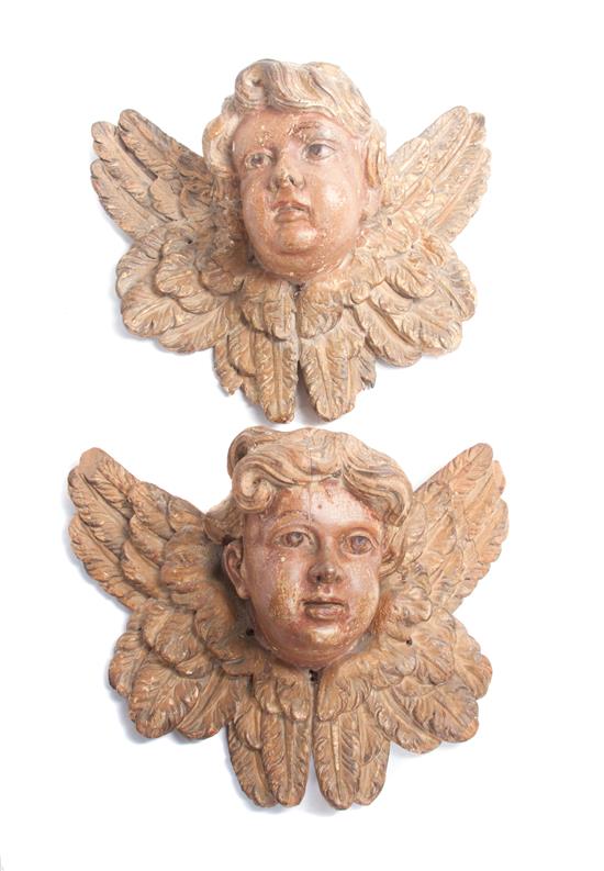 Appraisal: Sale Lot A Pair of Painted Wooden Masks depicting cherubs