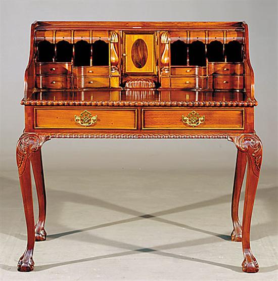 Appraisal: Georgian style carved mahogany desk three-quarter gallery enclosing superstructure of